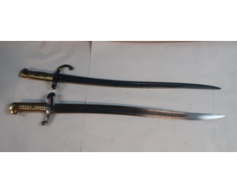 French Gras type bayonet stamped P Stevens Maastright B361, and another similar with brass grip and unusual quillion, the bac