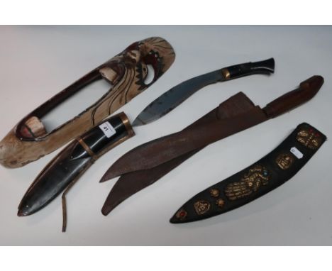 Decorative kukri knife with horn grip and scabbard with brass inlaid detail, another kukri leather sheath with brass and turq