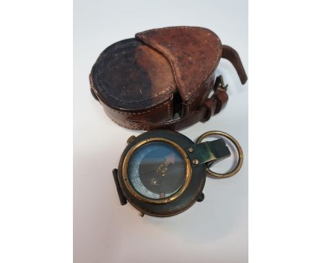 Leather cased British WWI marching compass with traces of blackening, the reverse marked Pitkin with broadarrow mark no.4 264