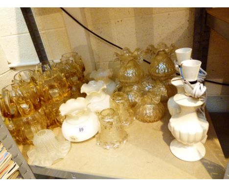 shelf of glass lampshades