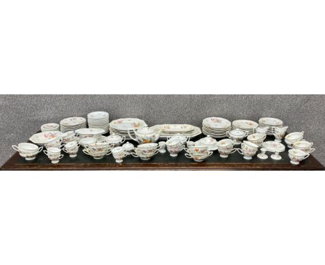 A large Rosenthal hand painted bone china tea service with a floral design. Eight dinner plates etc. W.38cm (largest)