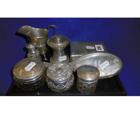 A HM SILVER CREAM JUG, FOUR SILVER TOPPED JARS, SILVER PLATED PEUGEOT PEPPER GRINDER AND A HM SILVER ART NOUVEAU CIGARETTE BO