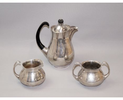 A matched silver-plated three-piece tea service designed by Eric Clements. Each piece of circular baluster form with flying s