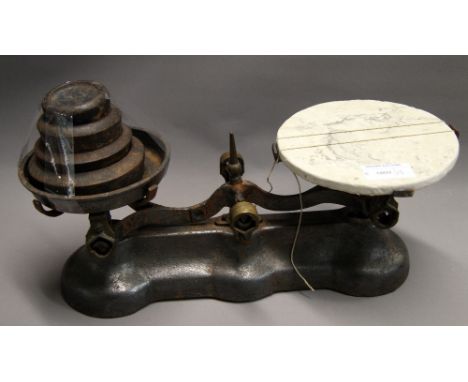A set of Victorian kitchen balance scales with a set of graduated weights 