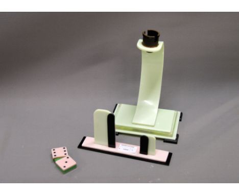 An Art Deco stepped acrylic lamp base together with a photograph stand and novelty cigarette lighter in the same style