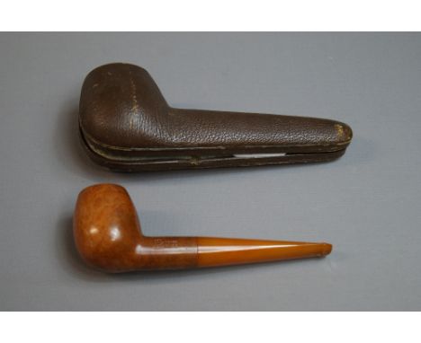 Peter Pump, a cased briar straight-apple pipe, together with a Zenith Van Der Want ceramic pipe, a Wade ceramic pipe stand an