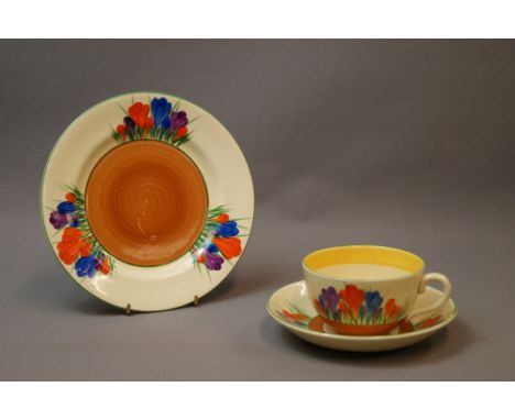 Clarice Cliff, a Bizarre trio comprising a cup, saucer and a side-plate in Crocus design