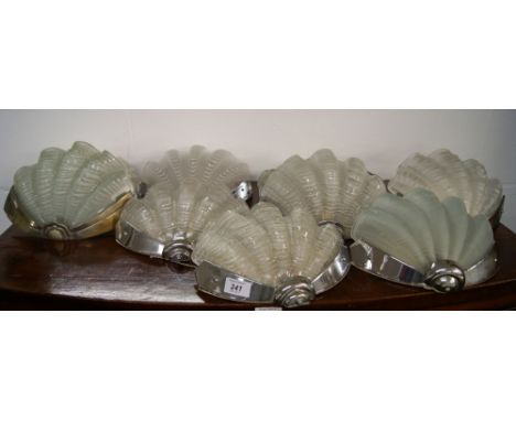 A set of six Art Deco wall lights with translucent glass shades in the form of sea shells, together with a similar set of thr