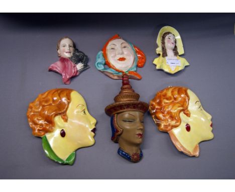 A selection of ceramic and plaster wall masks