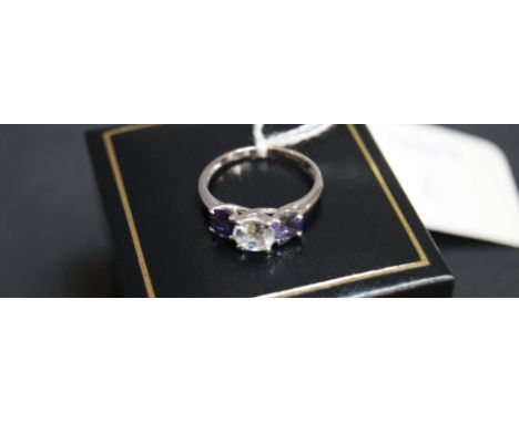 9 ct White gold blue topaz and amethyst ring. 
