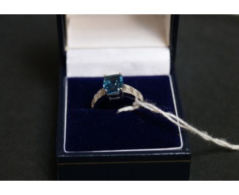 9 ct white gold, blue topaz and diamond ring. 