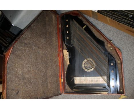A VINTAGE FAUDEL PHILIPS AND SONS OF LONDON ZITHER IN OAK CASE