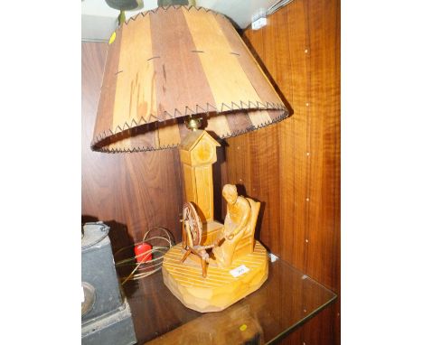 A CARVED TREEN FIGURATIVE LAMP SIGNED TO BASE