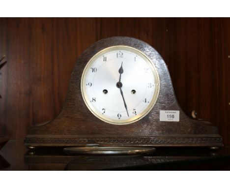A VINTAGE OAK NAPOLEON HAT MANTLE CLOCK