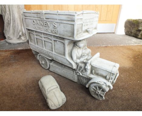 A STONE DOUBLE DECKER BUS PLANTER TOGETHER WITH A SMALL STONE BEETLE CAR