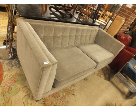 AN UPHOLSTERED MODERN THREE SEATER SOFA WITH LOOSE CUSHIONS