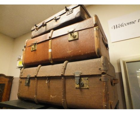 TWO VINTAGE BANDED PACKING TRUNKS AND A VINTAGE SUITCASE (3)
