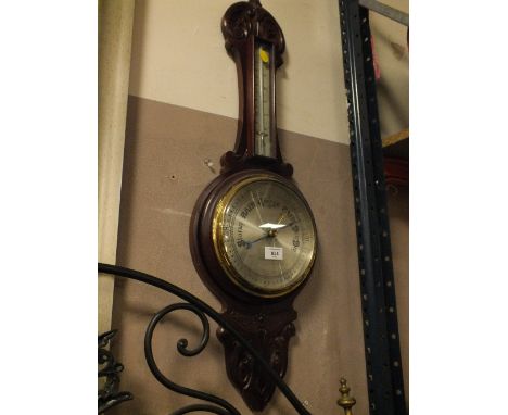 A MAHOGANY CARVED ANEROID BAROMETER