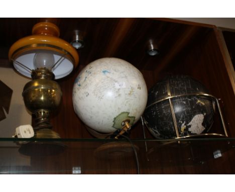 A LIGHT UP GLOBE TOGETHER WITH ANOTHER AND A CONVERTED OIL LAMP (3) 