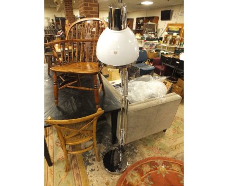 A MODERN CHROMED FLOOR STANDING SPOT LAMP