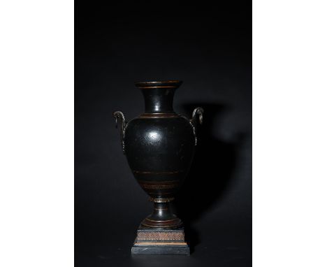 To be sold without reserve Property of Sir Christopher Ondaatje Late 19th Century A cast iron and enamel Neoclassical urn Dim