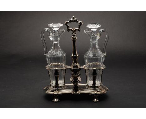 Property of Sir Christopher Ondaatje  20th century Two jugs and stoppers with caddy  Dimensions: 12 in. (H) x 9.5 in. (W)