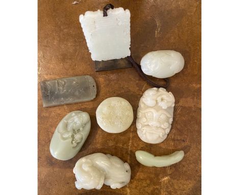 Property of a gentleman  Eight pieces of jade from a gentleman's collection Frog + lotusPlaque with vignettePlaque with figur