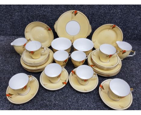 A CWS Windsor China Art Deco tea service comprising sandwich plate, teacups, saucer, tea plates, sugar bowls and cream jugs.