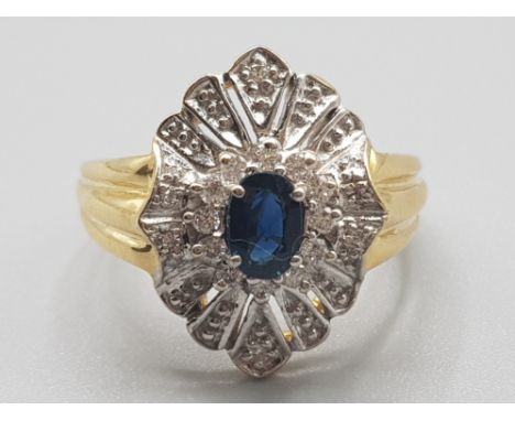 Ladies 18ct yellow gold diamond &amp; sapphire cluster ring, comprising of a blue sapphire set in the centre surrounded by a 