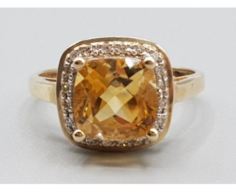 Ladies 9ct yellow gold citreen &amp; diamond ring, comprising of a cushion cut citreen stone in the centre surrounded by 20 d