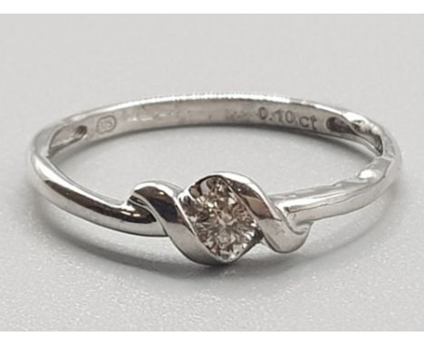 Ladies 9ct white gold diamond ring, comprising of a round brilliant cut diamond set in a rubover setting, approximately  .10c