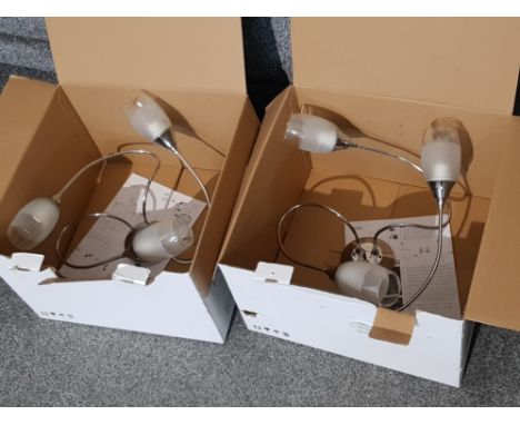 A pair of modern ceiling light fittings.