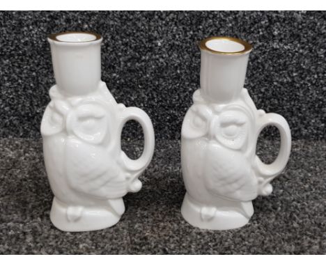 A pair of Royal Doulton ceramic chambersticks in the form of owls 13cm high (seconds).