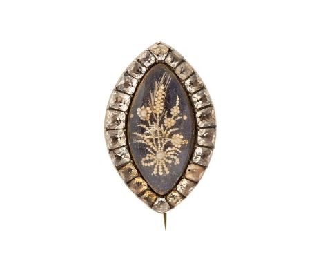 An 18th/19th century gold, enamel and paste navette shape brooch, the central blue enamel applied with a floral spray of seed