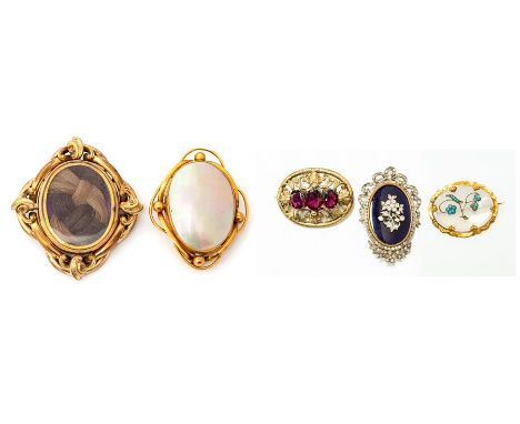 A Victorian gilt metal, chalcedony and turquoise oval brooch, the oval chalcedony set with a floral spray of cabochon turquoi