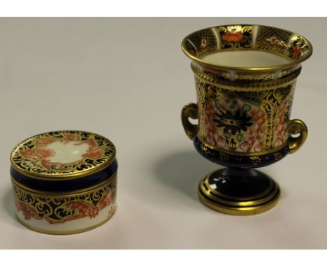 Two Royal Crown Derby bone china items - miniature two handled urn (date code 1918) and lidded trinket box (date code 1906)