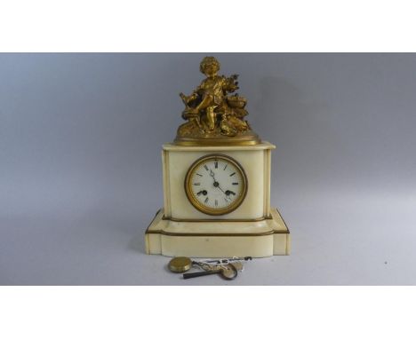 A French Alabaster and Gilt Metal Figural Mantel Clock Decorated with Seated Cherub Feeding Birds. 22.5cms Wide. Small Loss t