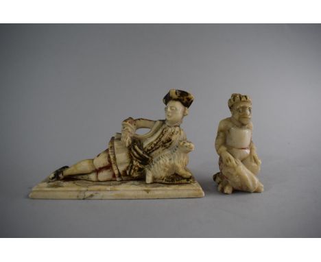 Two Early Carved Alabaster Figures, Reclining Gent with Dog and Seated Cross Legged Gent. Traces of Original Enamel Decoratio