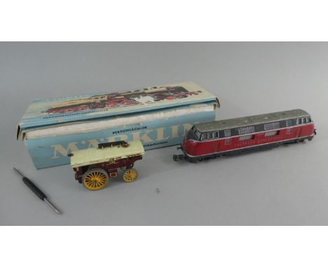 A Marklin Deutsche Bundesbahn OO Gauge Locomotive together with an Unrelated Marklin Box and a Matchbox Showmans Traction Eng