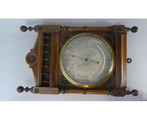 A 19th Century Aneroid Barometer in Ornate Carved Oak Case, with Silvered Dial and Curved Fahrenheit Thermometer, 50cm x 30cm
