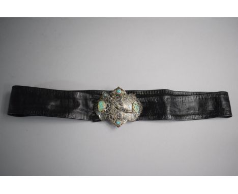 A Russian Silver and Leather Belt. The Buckle Etched and Jewelled with Turquoise Mounts and Clasp in the Form of Curved Dagge