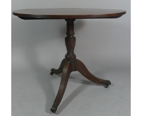 A 19th Century Mahogany Oval Topped Former Snap Top Tripod Table, 91cm Wide 