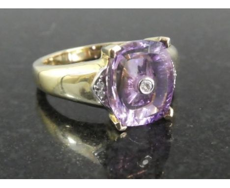 A 9ct Gold Dress Ring with Amethyst and Diamond Gold Weight 4.34gms. Amethyst 3.43 Carats. With Certificate of Authenticity. 