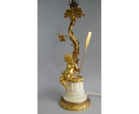 A Gilt and White Marble Figural Table Lamp with Seated Cherub Holding Oar, 47cm high 