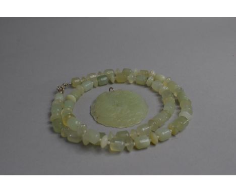 A Jade Necklace and a Carved Pendant Decorated with Pair of Dragons Chasing Flaming Pearl 