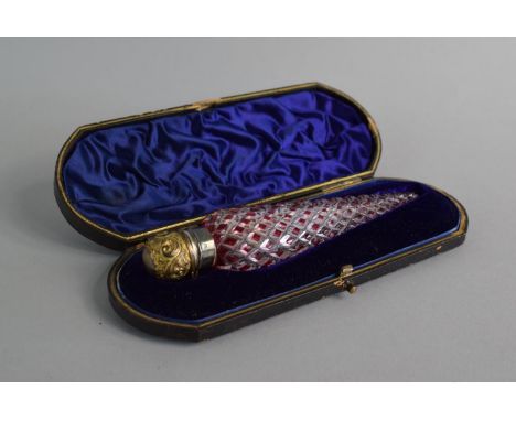 A Victorian Silver Mounted Perfume Flask with Ruby Overlay and Hinged Gilt Lid Over Inner Stopper. 15cm Long. In Original Cas