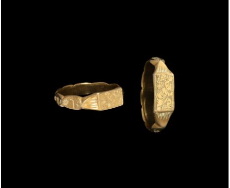 15th-mid 16th century AD. A gold iconographic ring with a rectangular hoop engraved with a depiction of St Christopher carryi