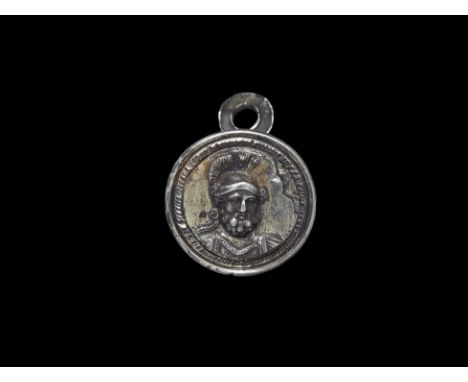 1st-2nd century AD. A silver-gilt cloak clasp with bust of a bearded and helmetted warrior, attachment loop to the reverse.  