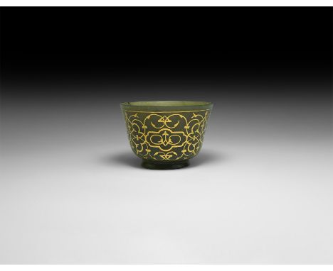 20th century AD or earlier. A carved jade bell-shaped cup with convex base, applied gold foil tracery to the outer wall. [A v