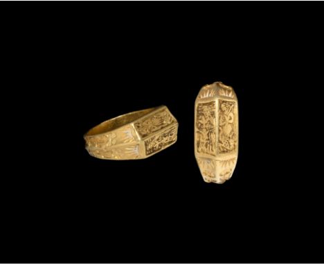 Early 15th century AD. A gold iconographic ring with twisted band detail to the underside, a pair of quatrefoil flowers on st